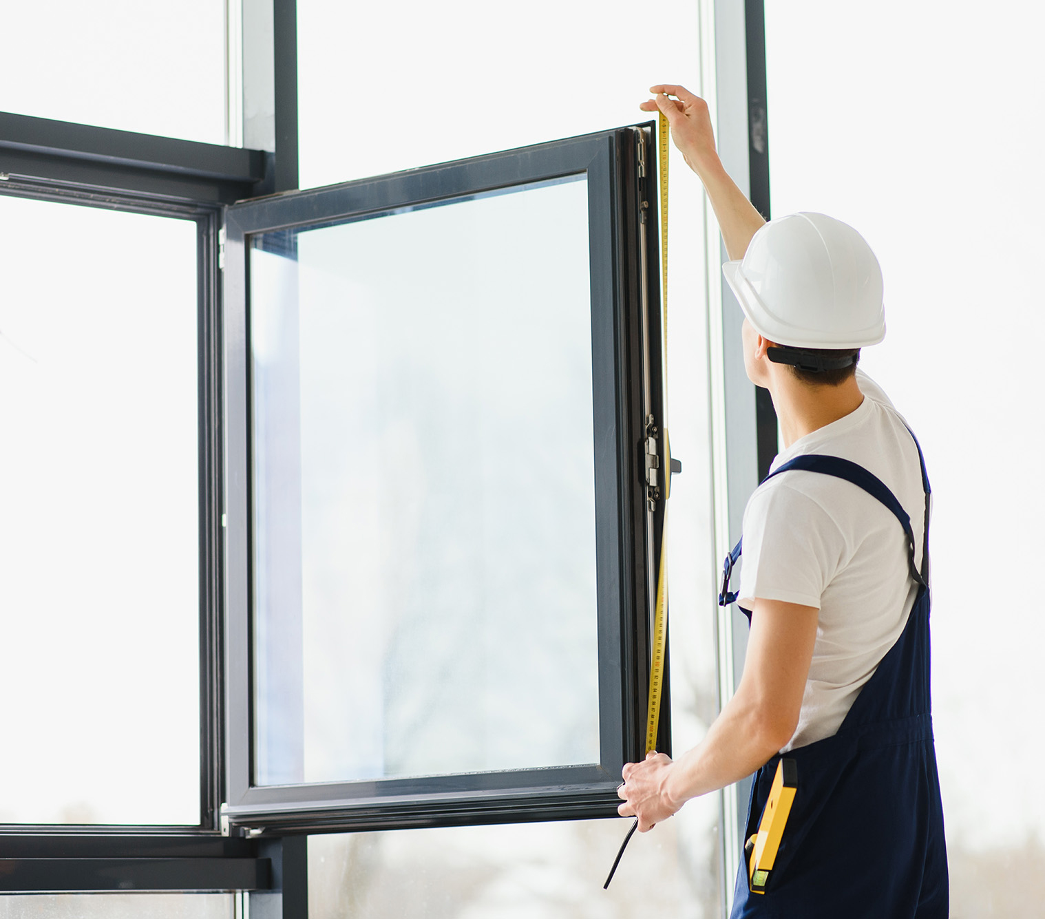 construction-worker-installing-window-house-2